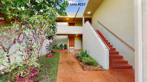 Front view of a two-story building with marked unit number 227.