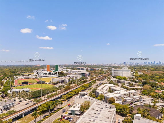 Wide angle view of urban area with buildings and landmarks in the distance.