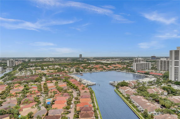 Panoramic view of residential area with water canal and high-rise buildings.