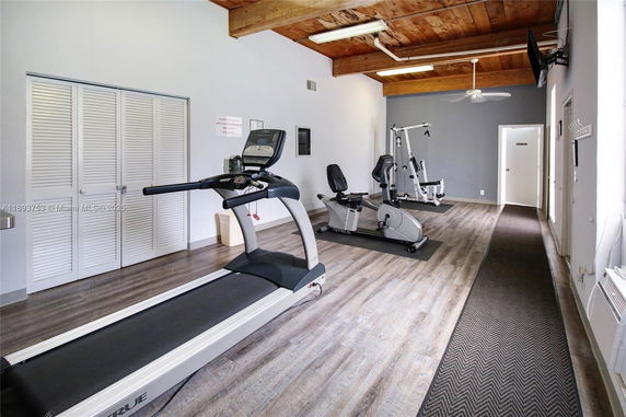 Indoor gym area with exercise equipment.