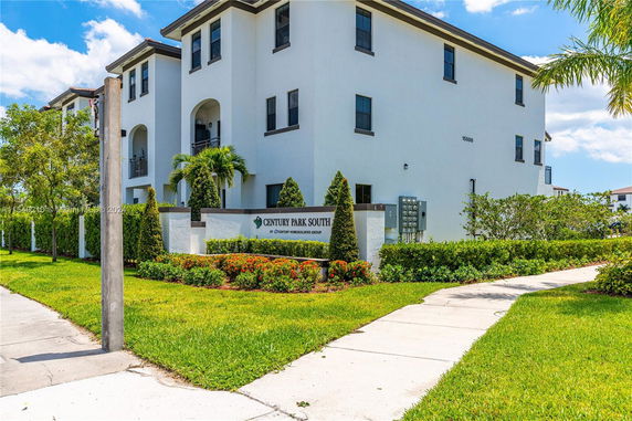 Front view of a multi-story residential building with a sign reading Century Park South.