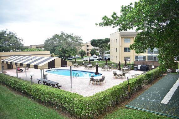 Outdoor view with a swimming pool and seating area.