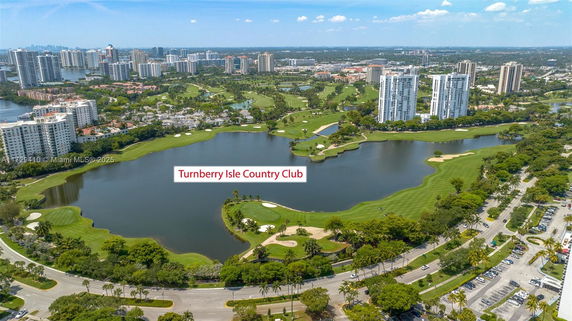 Aerial view of Turnberry Isle Country Club with surrounding buildings and golf course.