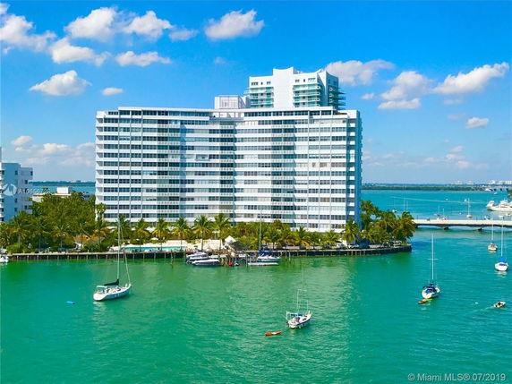 Front view of a multi-story waterfront building.
