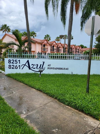 Front view of a building with multiple balconies and a sign reading 'Azul at Fontainebleau'.