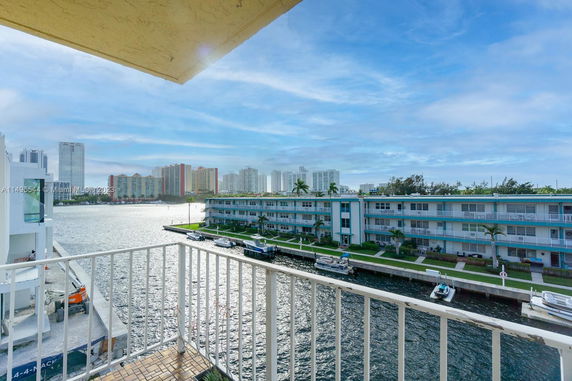 Panoramic view from a balcony overlooking a waterway and surrounding buildings.