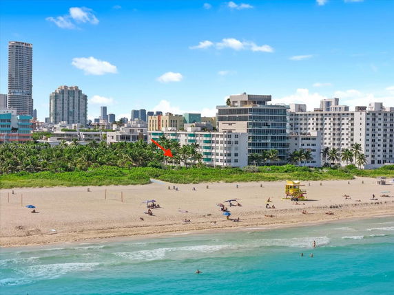 View of a beachfront area with multiple high-rise buildings in the background.