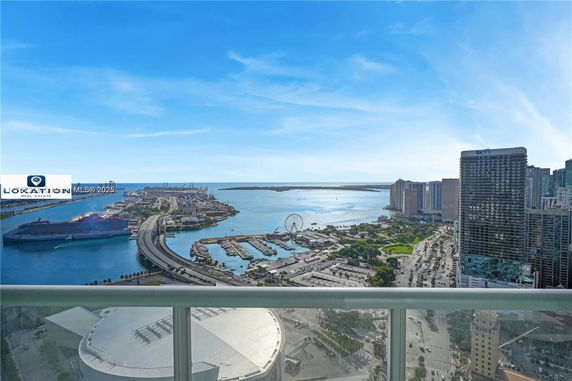 Panoramic view of a city skyline and waterfront from a building.