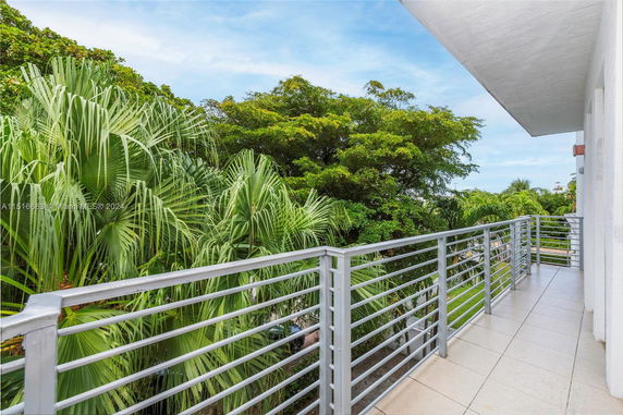 Balcony view of lush green foliage and trees