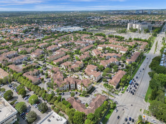 Aerial view of a residential neighborhood with multiple buildings and roads.