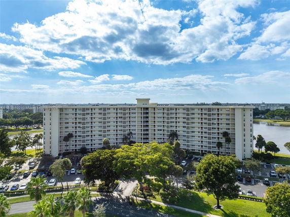 Front view of a multi-story residential building with balconies.