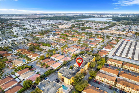 Aerial view of a residential area with various buildings and houses.
