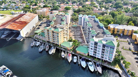 Aerial view of a waterfront property with buildings and a marina.