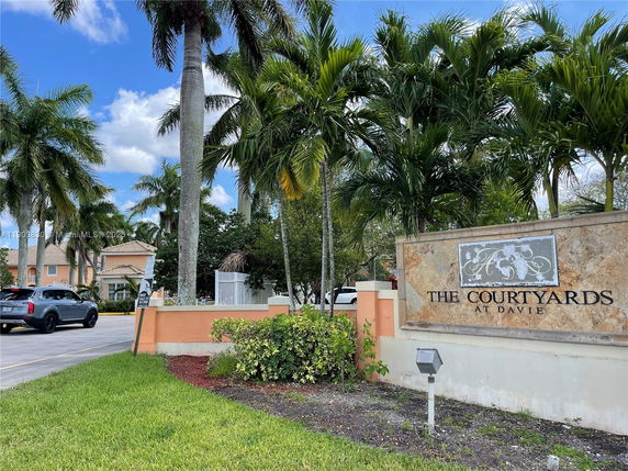 Entrance and sign for The Courtyards at Davie.