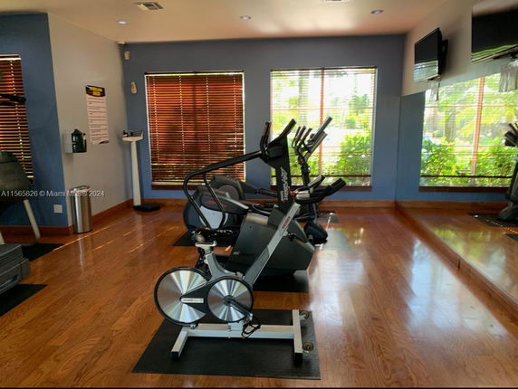 Indoor gym area with exercise equipment.