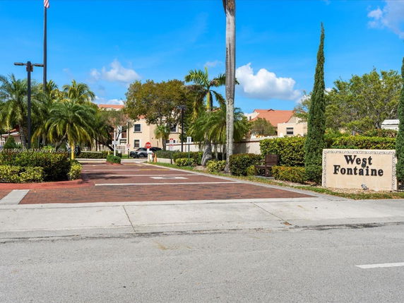 Entrance to a residential community with a sign that reads 'West Fontaine'.