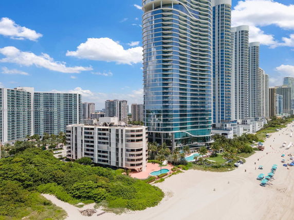 Elevated view of modern high-rise buildings near the beach.
