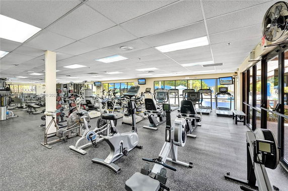 Interior view of a gym with various exercise equipment.
