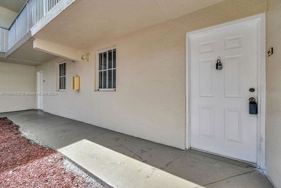 Front view of a building entrance with covered walkway