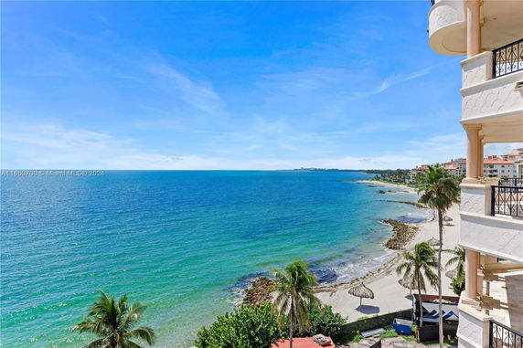 Panoramic view of a beachfront from a building balcony.