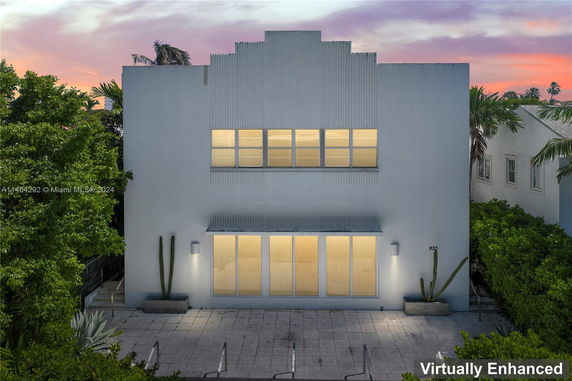 Front view of a modern two-story building with large windows.