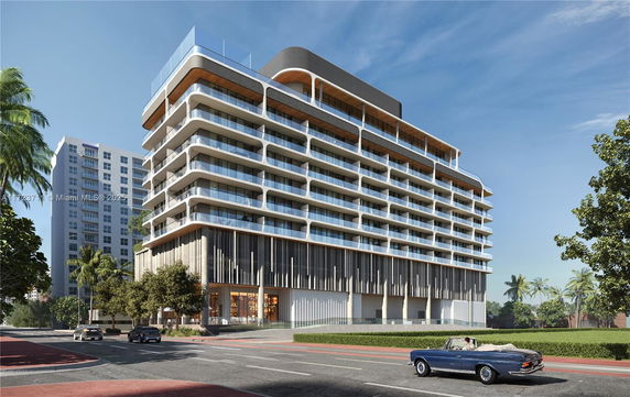 Front view of a modern multi-story building with balconies.