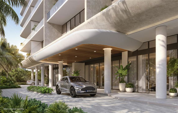 Front view of a modern multi-story building with a covered entrance and columns.