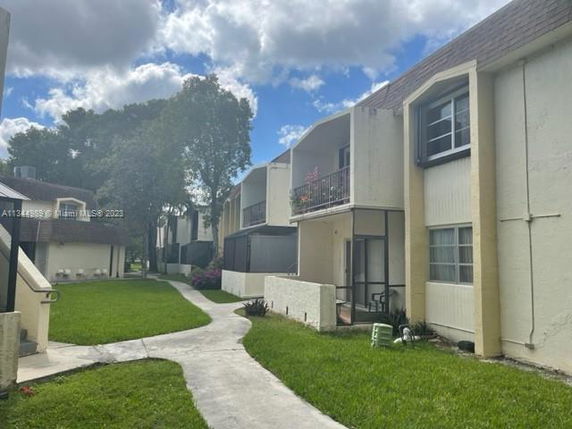Exterior view of multi-story residential buildings with balconies.