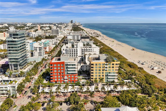 Panoramic view of a city with beachfront buildings next to the ocean.