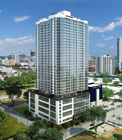 Front view of a high-rise building with glass facade.