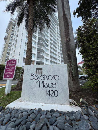 Front view of a multi-story residential building named Bayshore Place.
