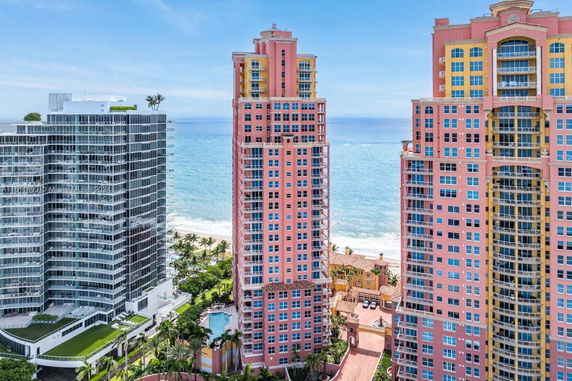 Front view of tall residential buildings near the ocean.