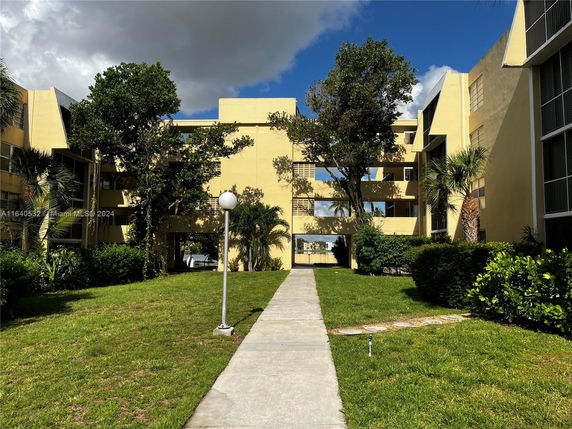 Front view of a multi-story building with a modern design.