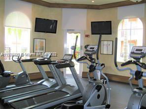 Indoor gym area with treadmills and exercise bikes.