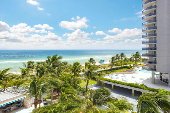 Panoramic view of a beachfront with a modern building.