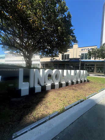 Front view of a commercial building with large Lincoln Road sign.
