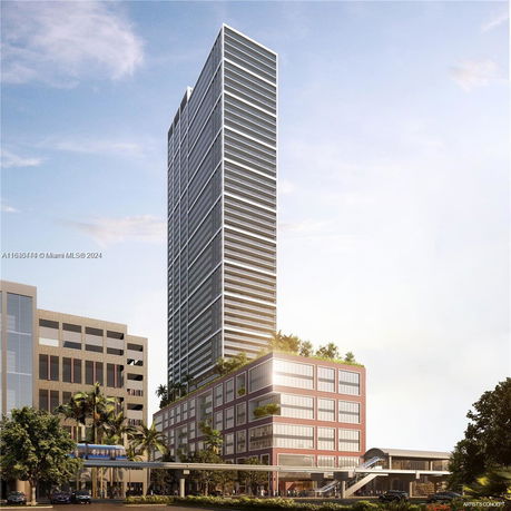 Front view of a modern, high-rise building with a sleek glass exterior and multiple floors, alongside a lower adjacent building.