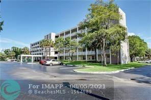 Front view of a multi-story residential building with balconies.