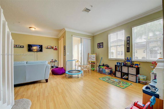 Room with toys and furniture suitable for children's play.
