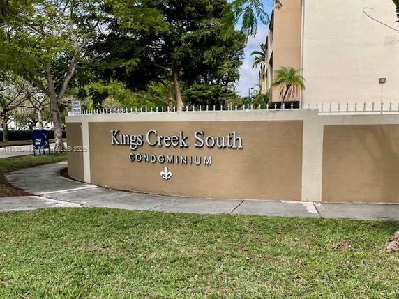 Front view of a condominium building sign for Kings Creek South.