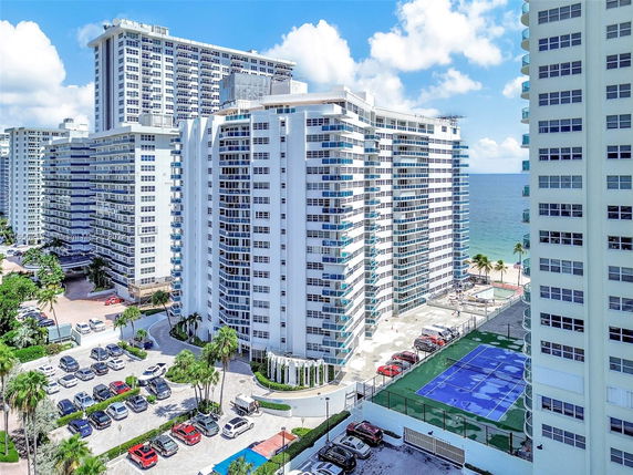 Aerial view of high-rise apartment buildings near the beach.