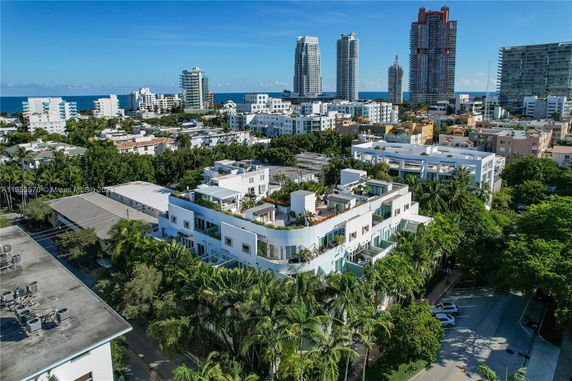 Aerial view of buildings with modern architecture in a coastal urban area.