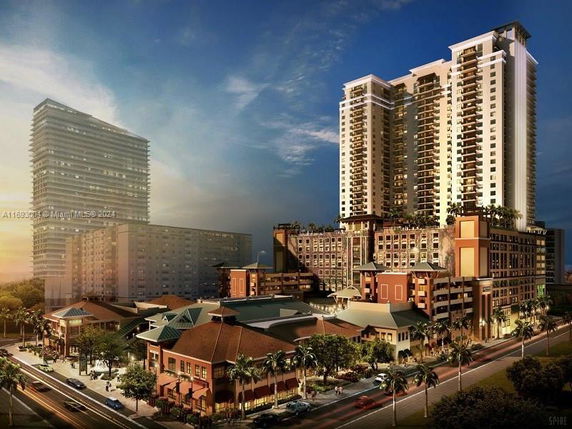 Front view of a large, multi-story residential and commercial complex with modern architectural design.