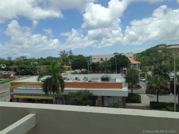 View from above of a commercial area with a McDonald's and surrounding buildings.