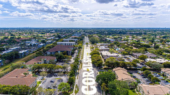 Panoramic aerial view of a suburban area with roads and buildings.