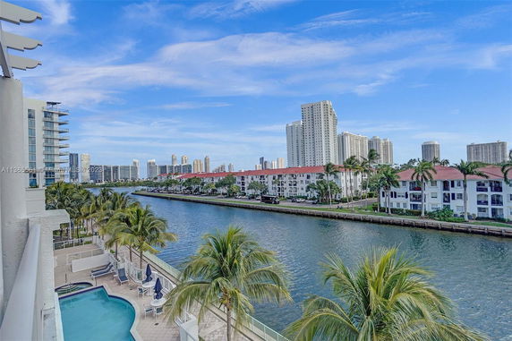 View of high-rise buildings and residential complexes along a waterway.