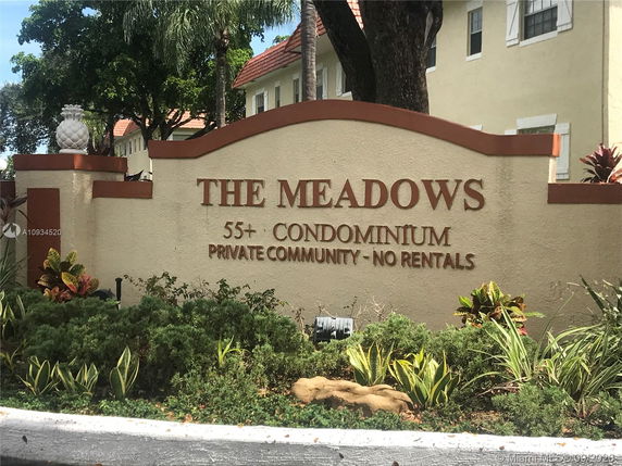 Entrance sign of The Meadows condominium private community.