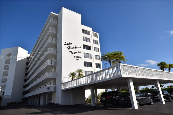 Front view of a multi-story residential building named Lake Harbour Towers.