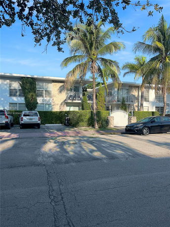 Front view of a two-story residential building with balconies.
