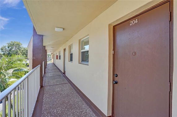Corridor view from a building with a visible surrounding area.